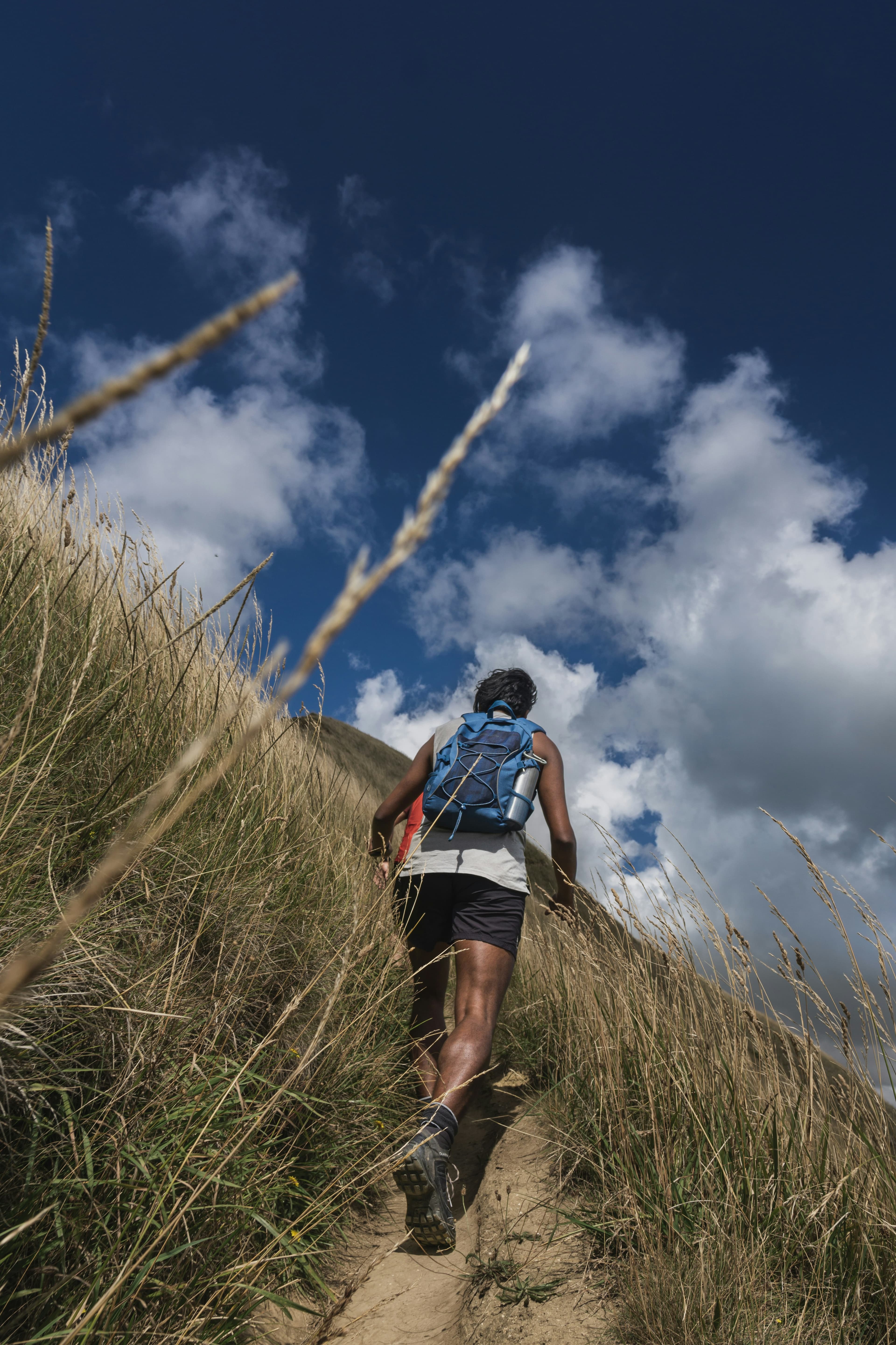 Hiker with backpack planning a route