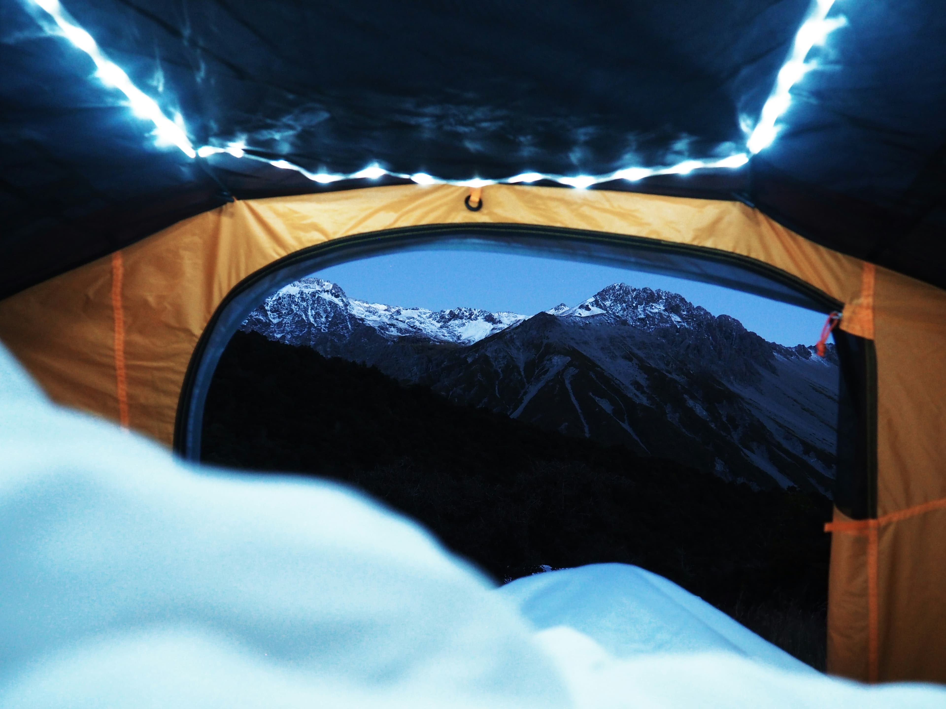 Family camping tent with mountain view